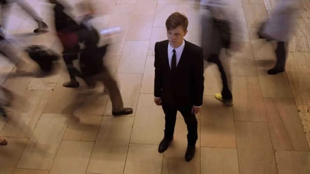 crowd-of-people-walking-around-one-man-standing-business-commuters-background_bmw5g9m7b__F0011-01_40