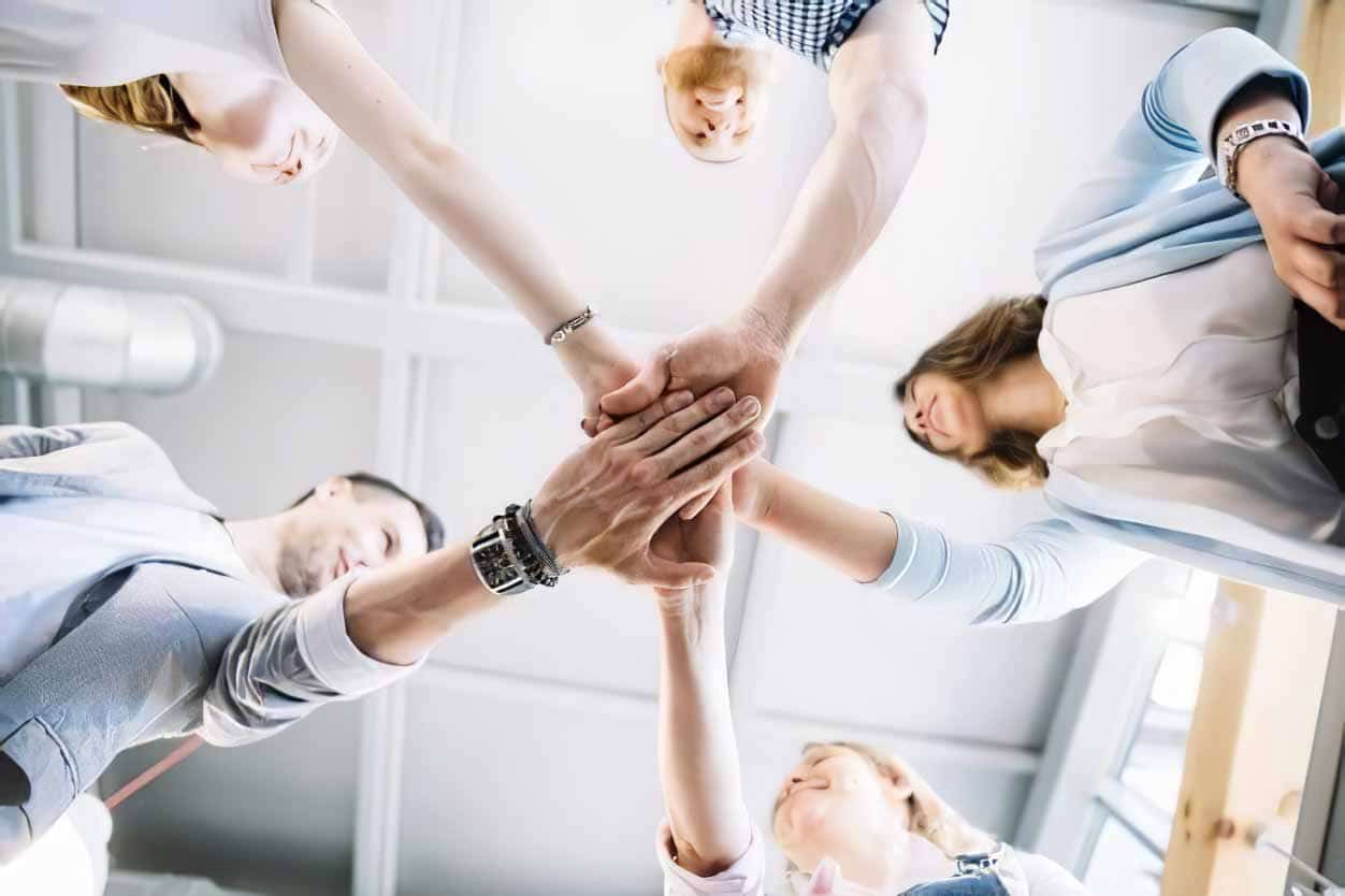 group presentation tips team holding hands lg 01